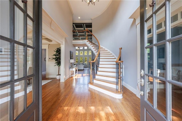 652 Pathview Ct, Dacula, GA 30019 - entrance foyer with a high ceiling, stairs, baseboards, wood finished floors, and french doors
