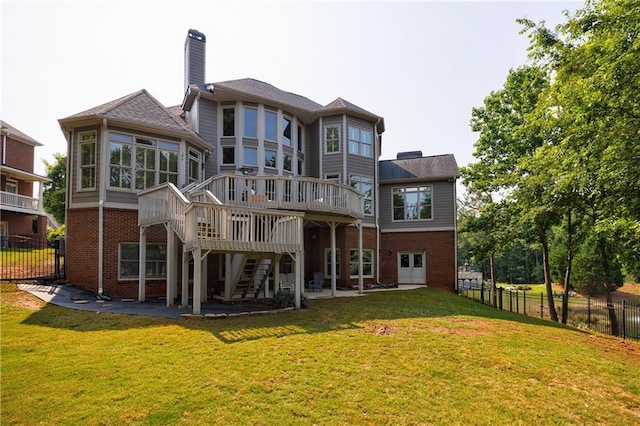 652 Pathview Ct, Dacula, GA 30019 - rear view of house with brick siding, a deck, stairs, a chimney, and a patio area