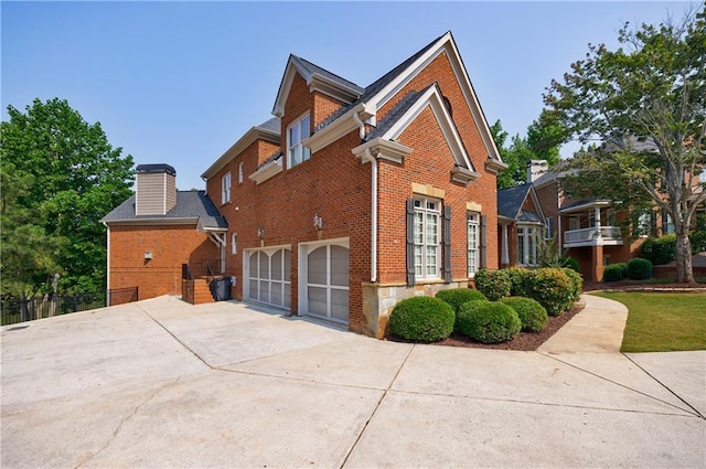 652 Pathview Ct, Dacula, GA 30019 - view of side of property with brick siding, a garage, and driveway