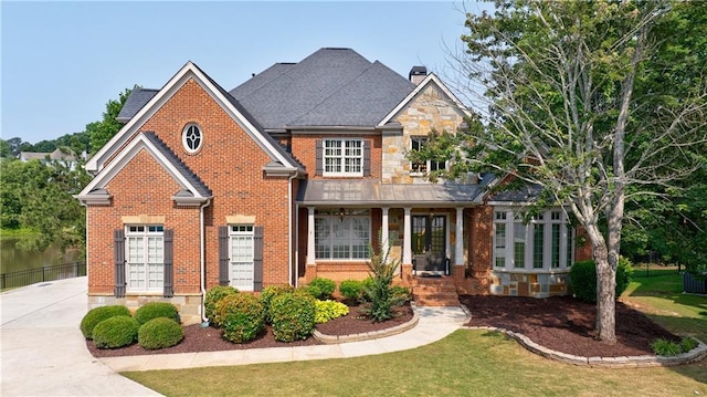 652 Pathview Ct, Dacula, GA 30019 - view of front of home with brick siding, a chimney, a front lawn, and french doors