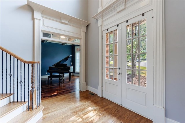 652 Pathview Ct, Dacula, GA 30019 - foyer entrance with french doors, wood finished floors, and baseboards
