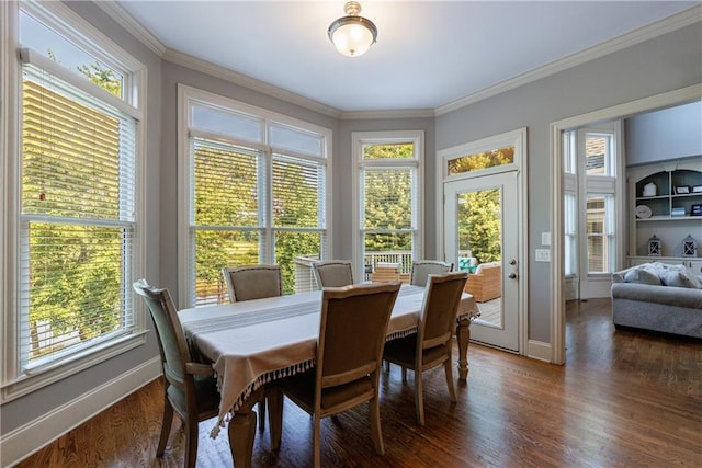 652 Pathview Ct, Dacula, GA 30019 - dining room with healthy amount of natural light, dark wood-style flooring, baseboards, and crown molding