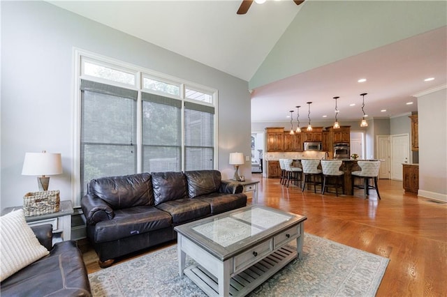 652 Pathview Ct, Dacula, GA 30019 - living area with ceiling fan, lofted ceiling, light wood finished floors, and recessed lighting