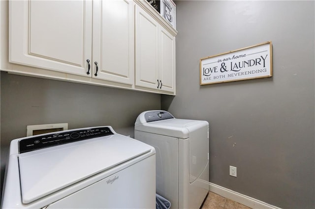652 Pathview Ct, Dacula, GA 30019 - washroom with cabinet space, washer and clothes dryer, baseboards, and light tile patterned floors