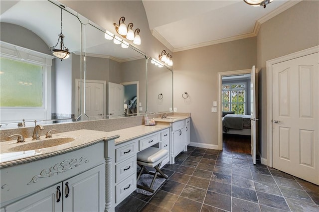 652 Pathview Ct, Dacula, GA 30019 - bathroom featuring double vanity, baseboards, ensuite bathroom, stone finish flooring, and crown molding
