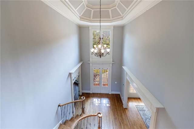 652 Pathview Ct, Dacula, GA 30019 - foyer entrance featuring healthy amount of natural light, a chandelier, ornamental molding, wood finished floors, and baseboards