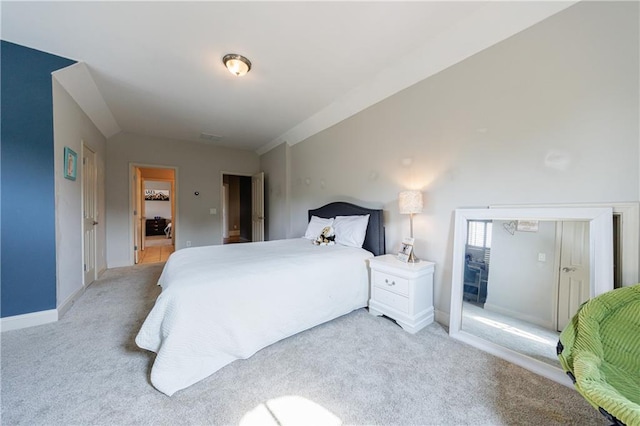 652 Pathview Ct, Dacula, GA 30019 - bedroom with light carpet, vaulted ceiling, and baseboards