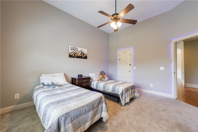 652 Pathview Ct, Dacula, GA 30019 - bedroom with carpet, baseboards, high vaulted ceiling, and a ceiling fan