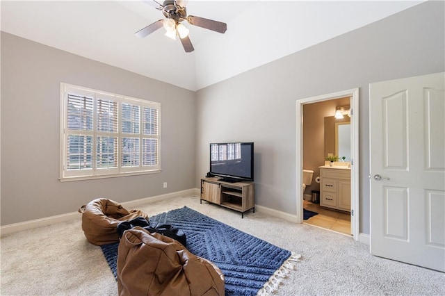 652 Pathview Ct, Dacula, GA 30019 - sitting room with light carpet, a ceiling fan, baseboards, and lofted ceiling