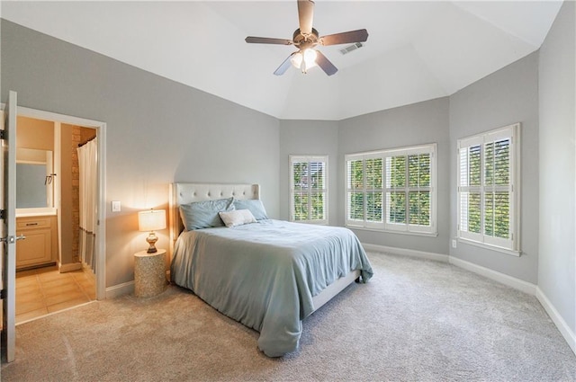 652 Pathview Ct, Dacula, GA 30019 - bedroom with light carpet, baseboards, high vaulted ceiling, ceiling fan, and connected bathroom