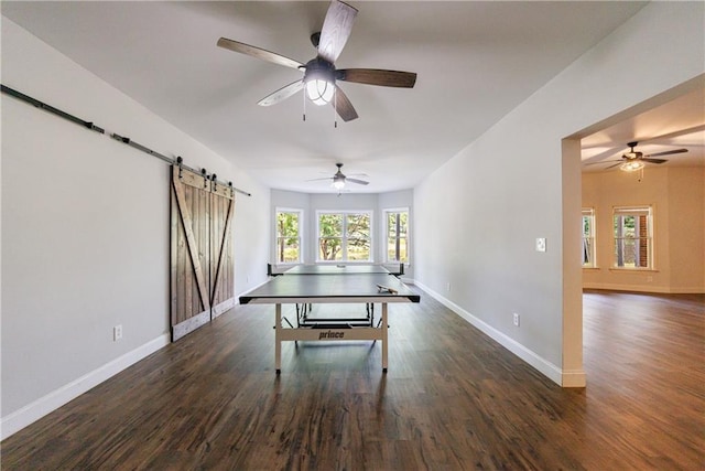 652 Pathview Ct, Dacula, GA 30019 - recreation room with a barn door, a ceiling fan, baseboards, and wood finished floors
