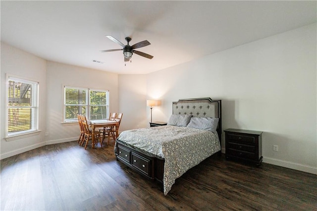 652 Pathview Ct, Dacula, GA 30019 - bedroom with dark wood finished floors, baseboards, and a ceiling fan