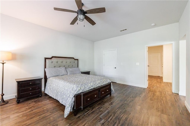 652 Pathview Ct, Dacula, GA 30019 - bedroom featuring dark wood finished floors, baseboards, and a ceiling fan