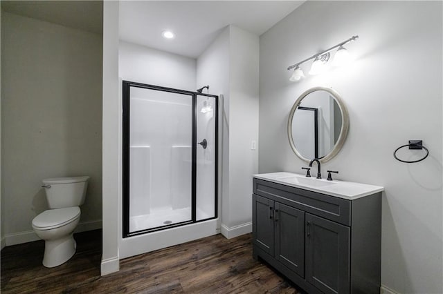 652 Pathview Ct, Dacula, GA 30019 - full bathroom with a shower stall, wood finished floors, baseboards, vanity, and recessed lighting