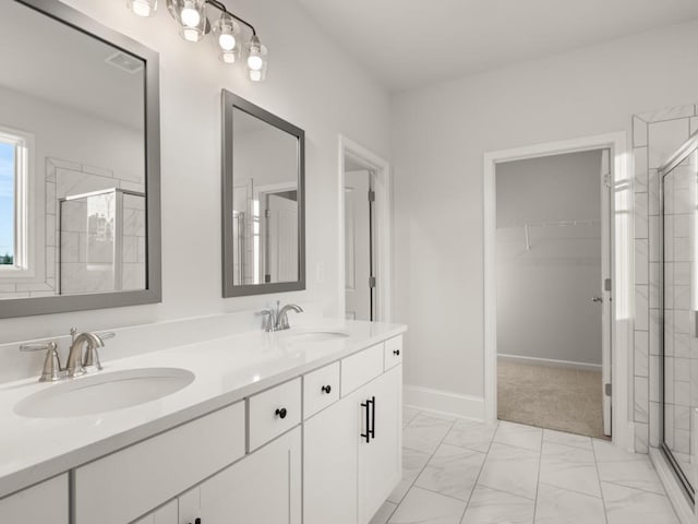 bathroom featuring an enclosed shower and vanity