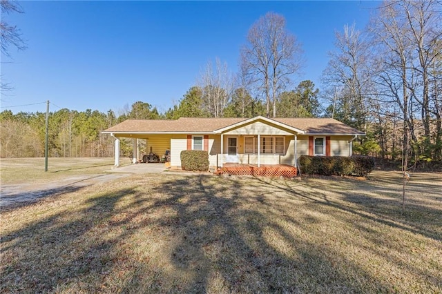 ranch-style home featuring a front yard, a porch, and a carport