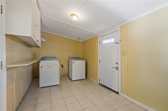 laundry room featuring washing machine and dryer and cabinets