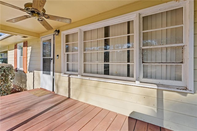 wooden deck featuring ceiling fan