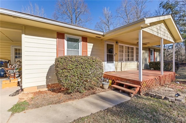 property entrance with a wooden deck