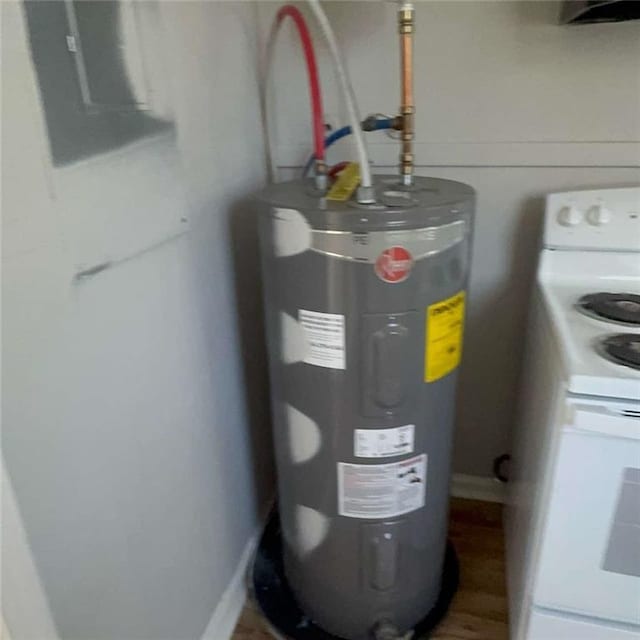 utility room featuring electric water heater