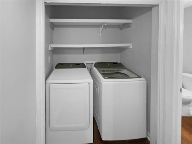 clothes washing area with washer and dryer