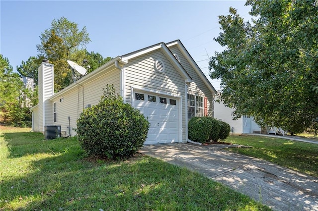 view of home's exterior with concrete driveway, a lawn, an attached garage, and central AC unit