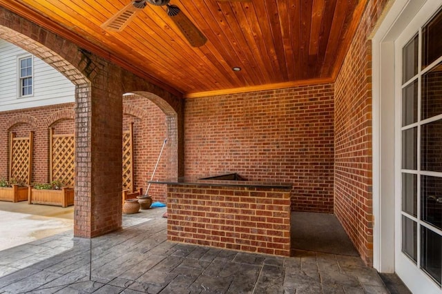 view of patio featuring ceiling fan