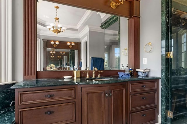 bathroom with vanity, ornamental molding, and an inviting chandelier