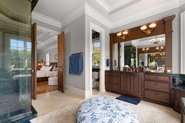 bathroom featuring tile patterned flooring, crown molding, a chandelier, vanity, and a shower with shower door