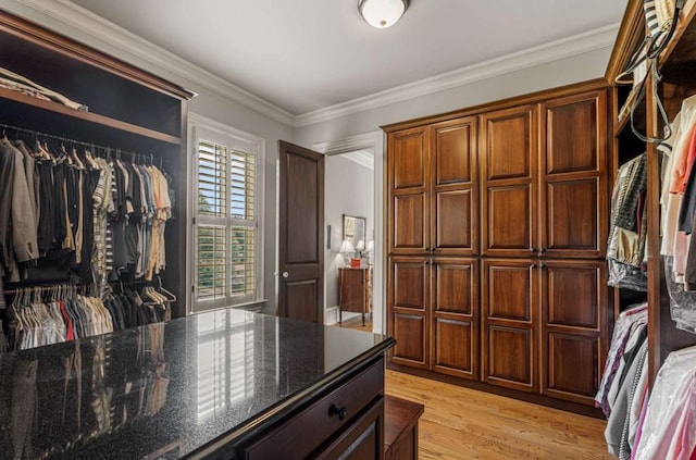 spacious closet with light hardwood / wood-style floors