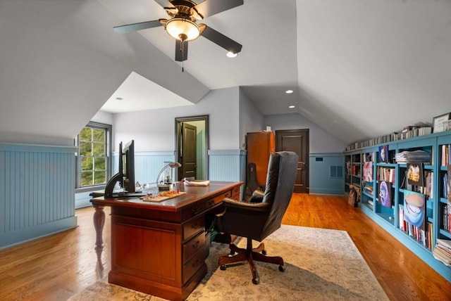 office featuring light hardwood / wood-style floors, ceiling fan, and lofted ceiling