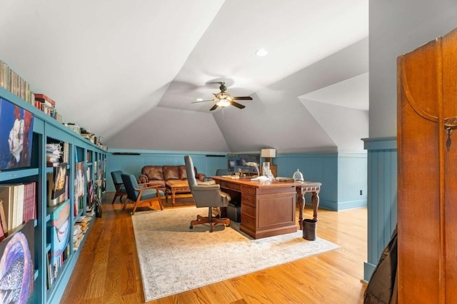 home office with wood-type flooring, ceiling fan, and lofted ceiling