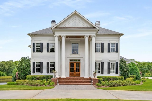 greek revival house with french doors