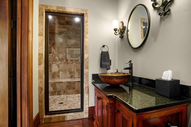 bathroom with vanity and a shower with shower door