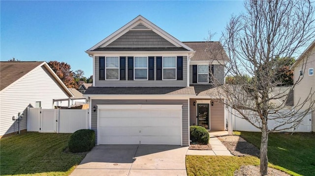 view of front of property featuring a garage and a front lawn