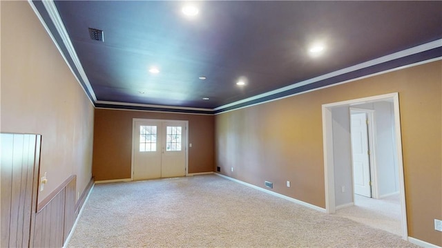 unfurnished room with light carpet and crown molding