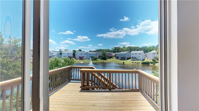 wooden deck with a water view