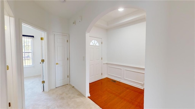 foyer with light carpet