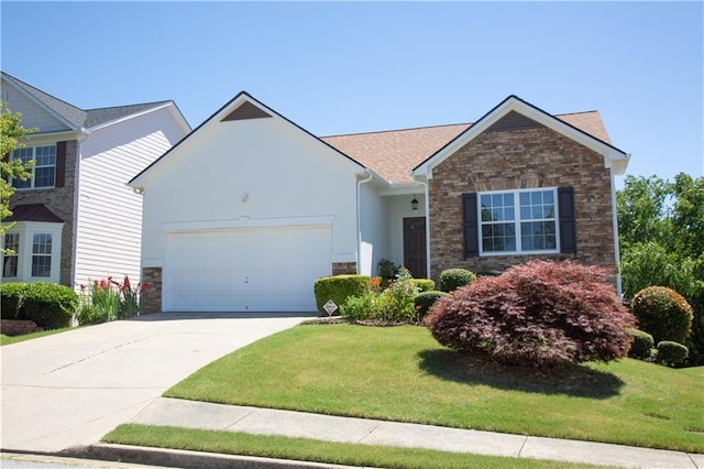 view of front of home with a front yard and a garage