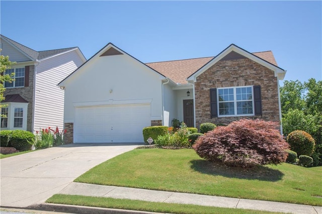 view of front of property featuring a front yard and a garage