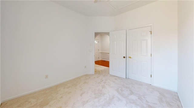 unfurnished bedroom with light colored carpet