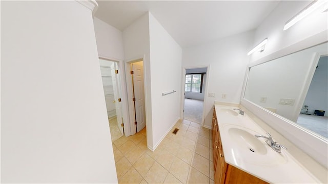 bathroom with tile patterned flooring and vanity