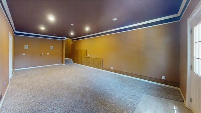 unfurnished room featuring light colored carpet and ornamental molding