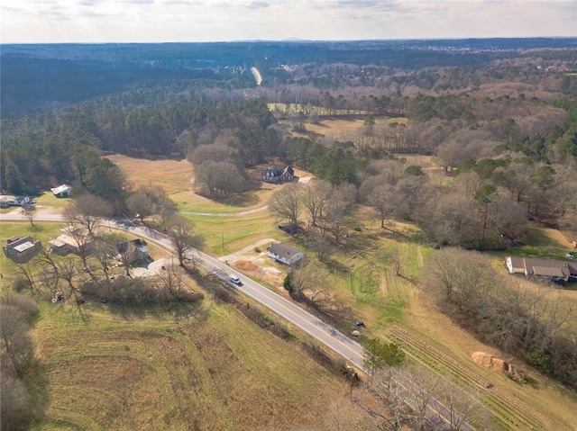 birds eye view of property featuring a rural view