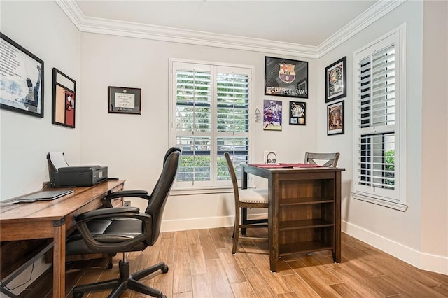 office featuring crown molding, baseboards, and light wood-style floors