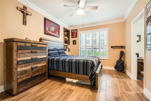 bedroom with crown molding, baseboards, ceiling fan, and light wood-style floors
