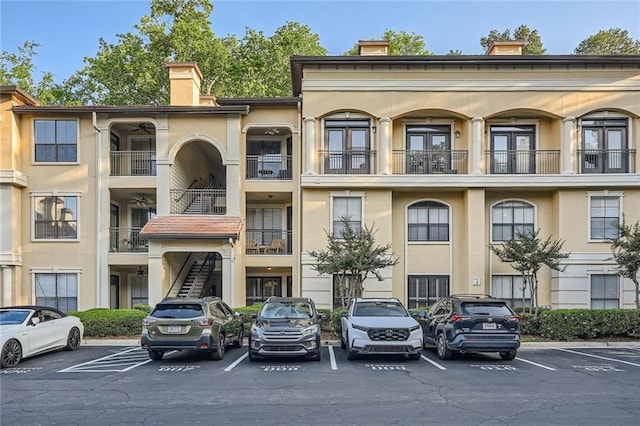 view of property featuring uncovered parking