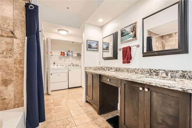 interior space featuring separate washer and dryer, light tile patterned floors, a sink, and dark brown cabinets