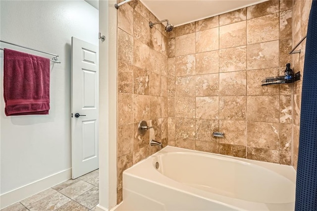 full bathroom with baseboards and shower / tub combination