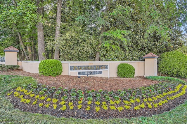 community sign with fence